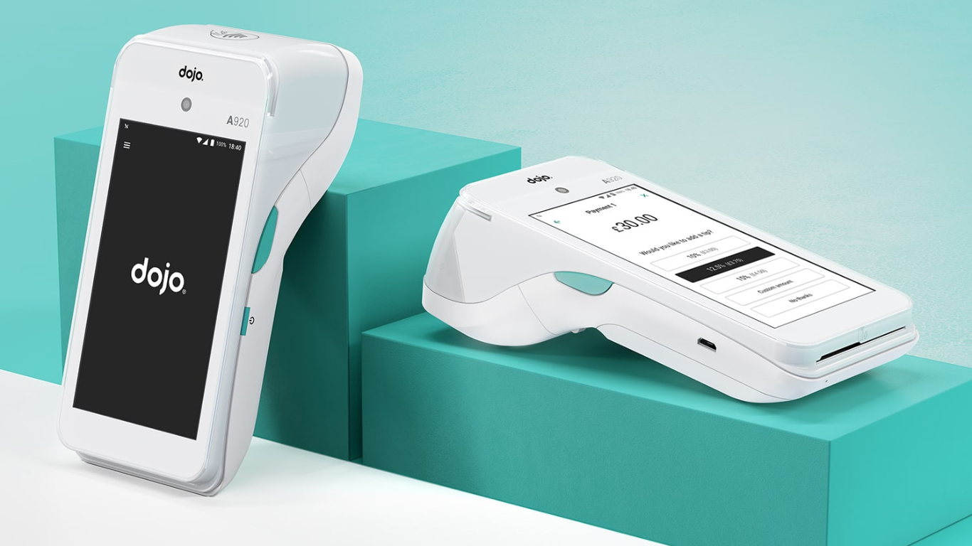 two dojo payment handsets with turquoise boxes behind them two dojo payment handsets with turquoise boxes behind them